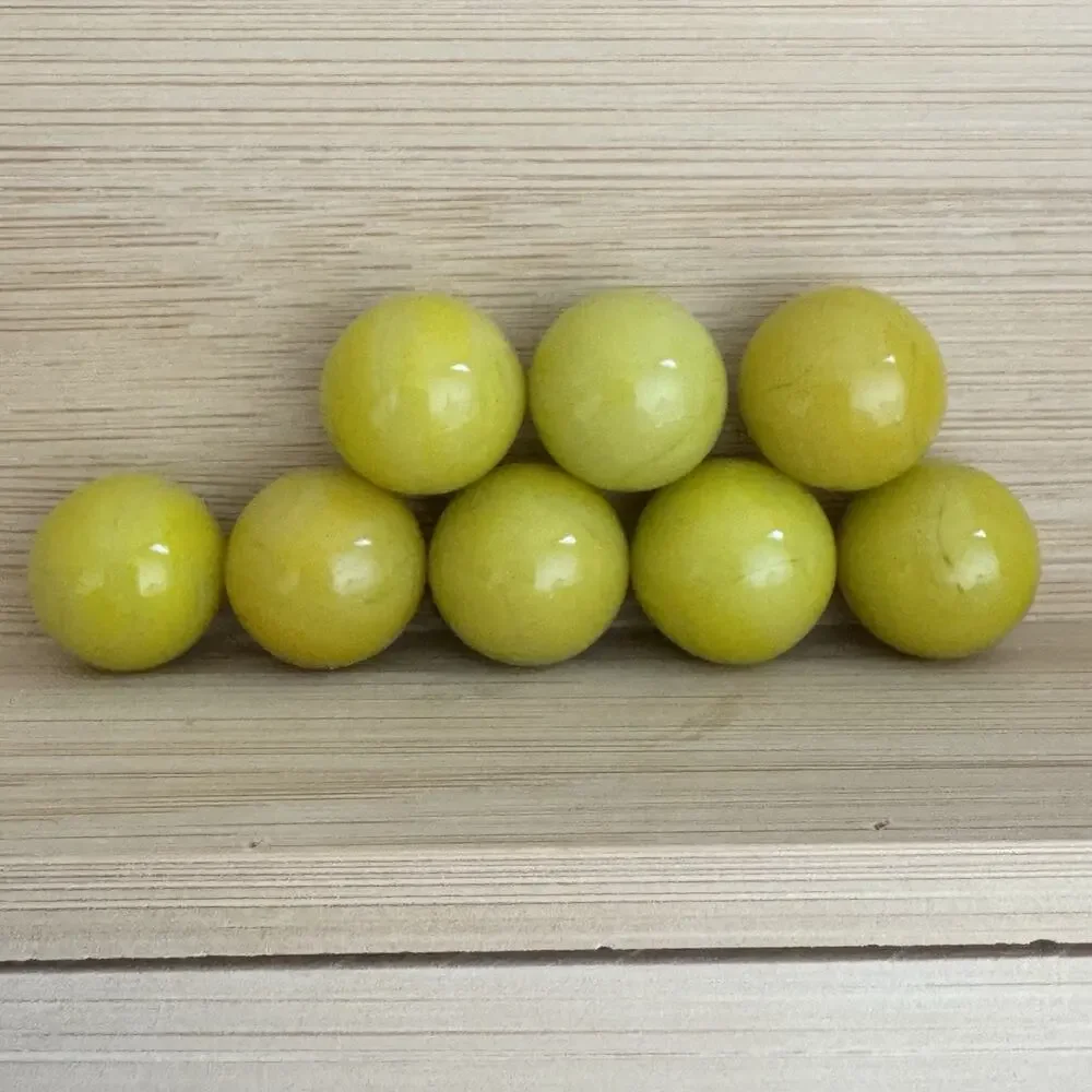 Lot Of 8 Yellow Glass Marbles Glows Orange Cadmium Vintage